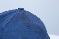 Close-up of a 31 Hats cap with bold stitching and a classic design on a neutral background.
