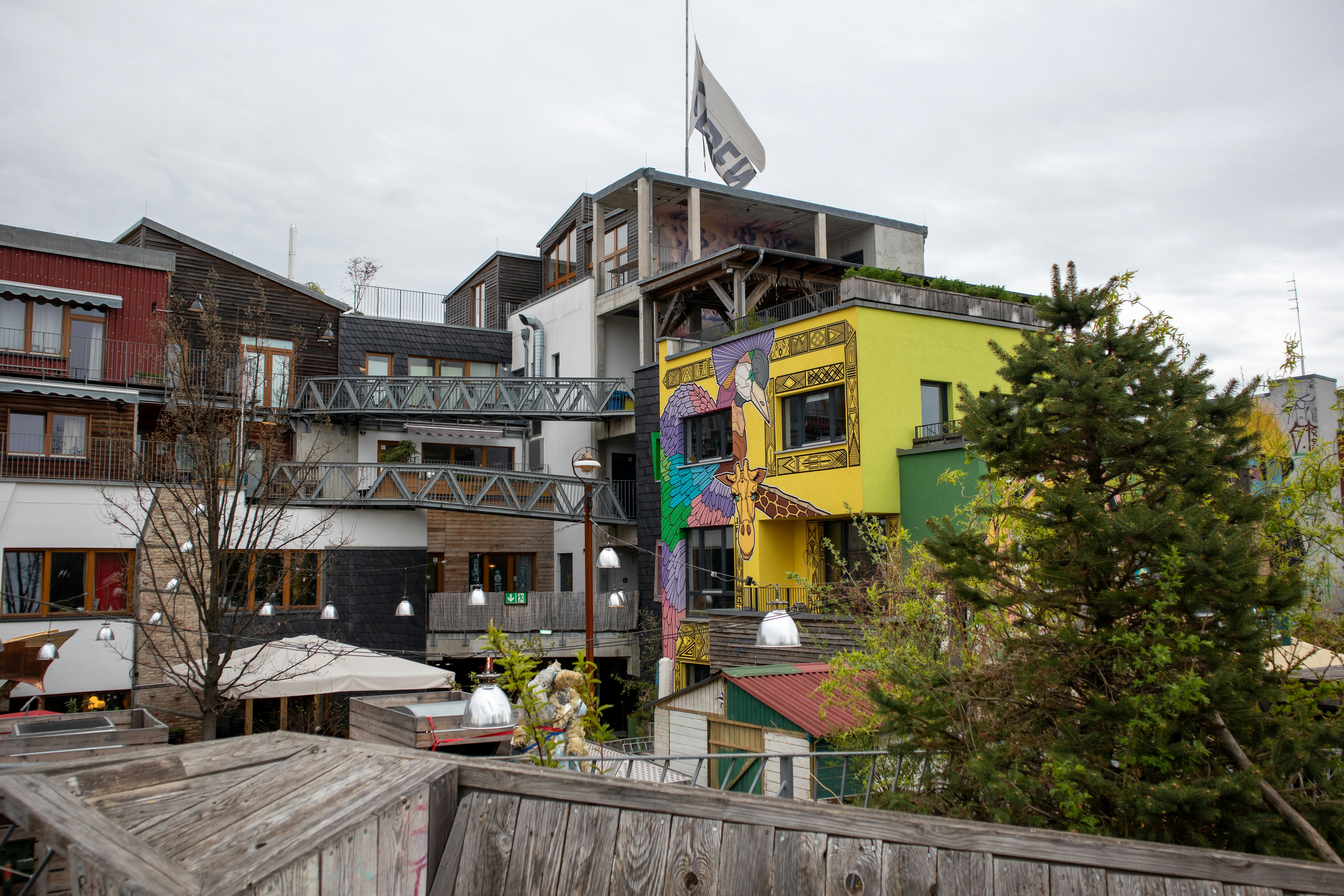 a colorful building with a flag on top