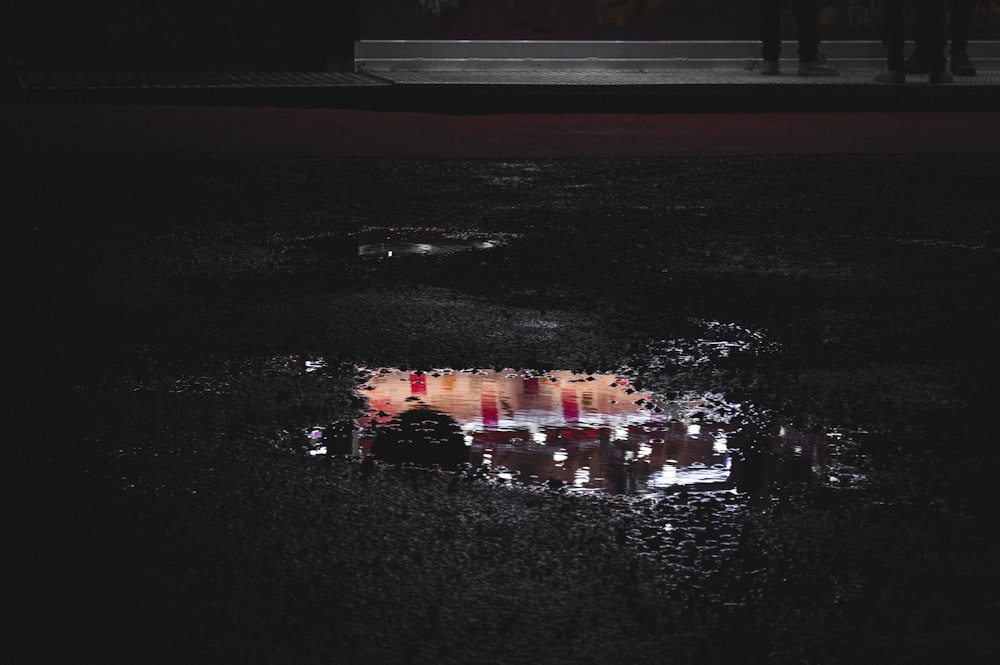 a group of people on a street at night