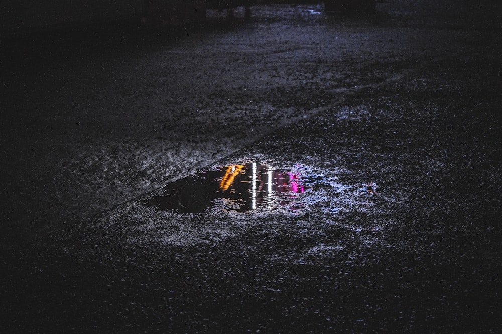 a lighted sign in the dark