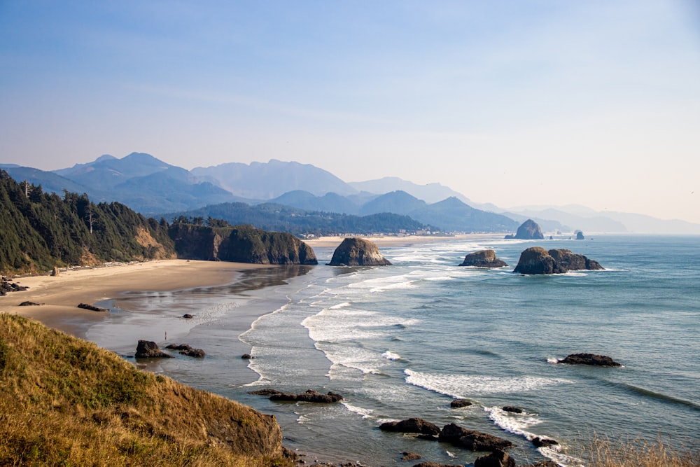 a beach with rocks and water