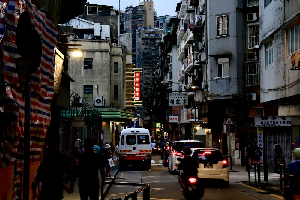 a busy street with cars and people