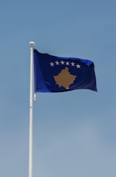 a blue flag on a pole