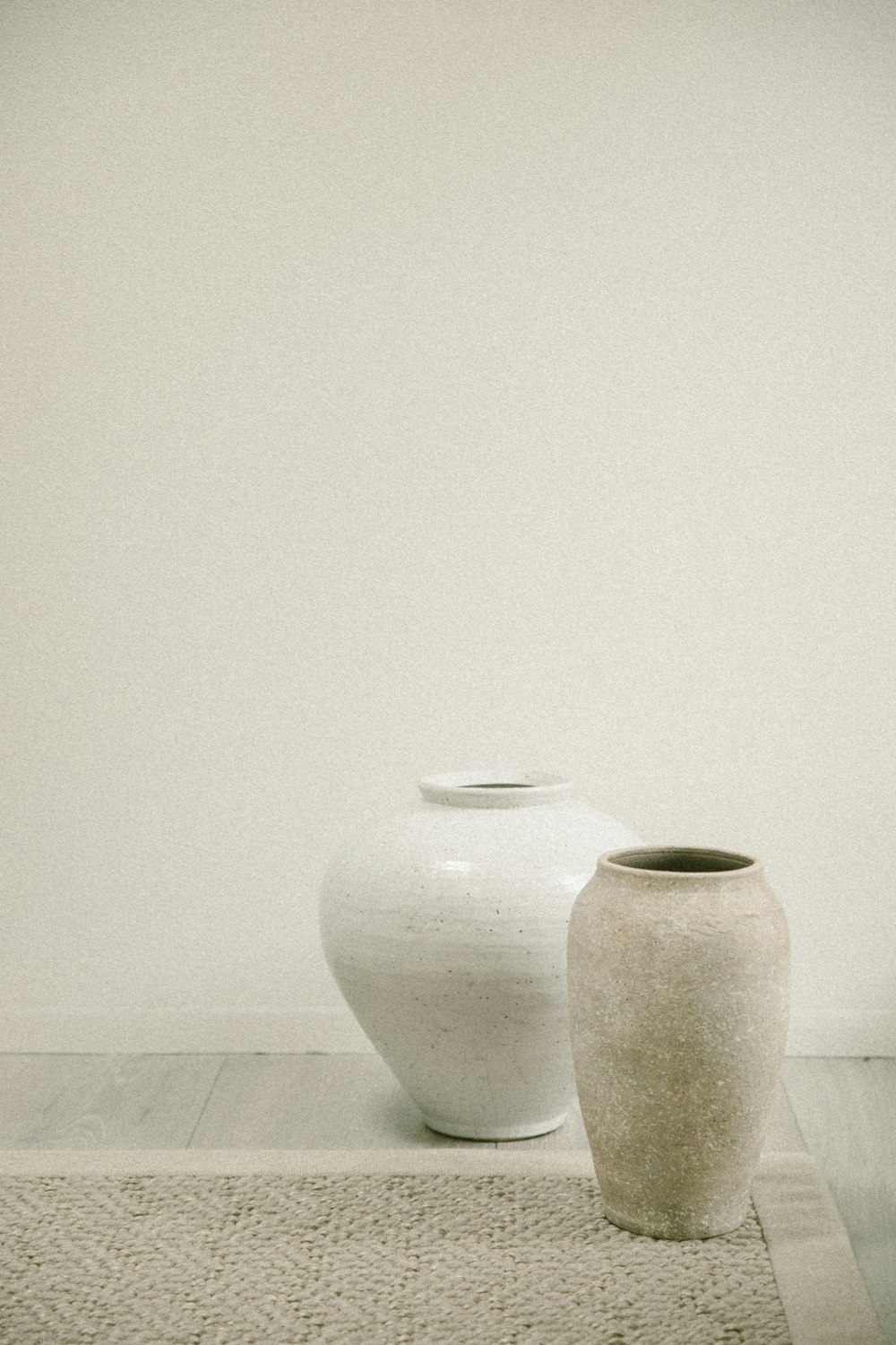 a couple of vases on a counter