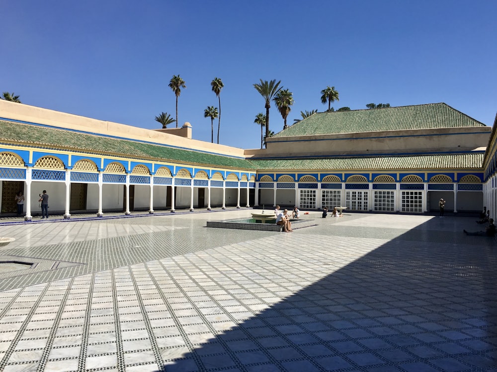 a courtyard with Bahia Palace in the background