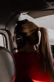 Close-up of a customer support agent assisting a traveler via headset.