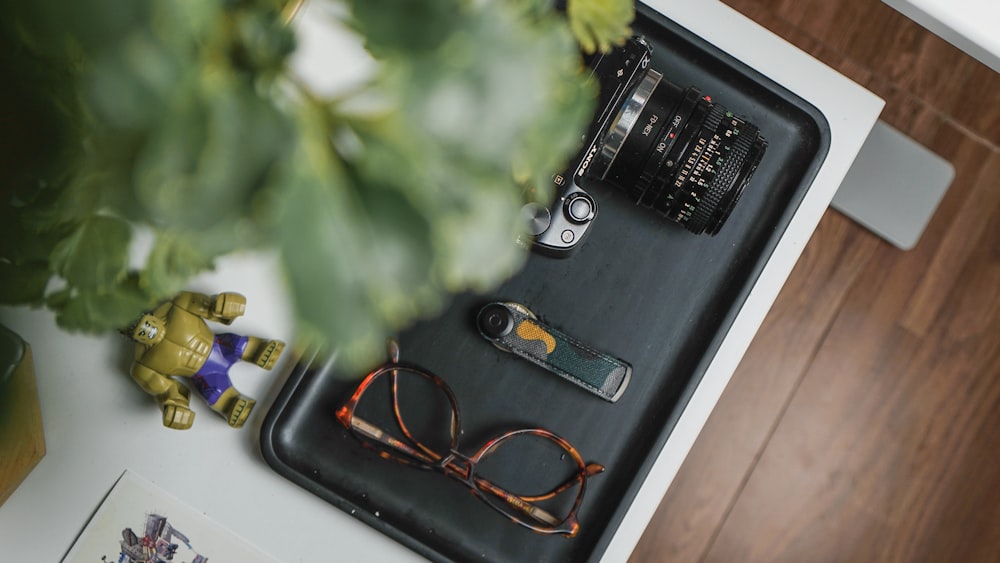 a black box with a key and a gold key on a wooden surface