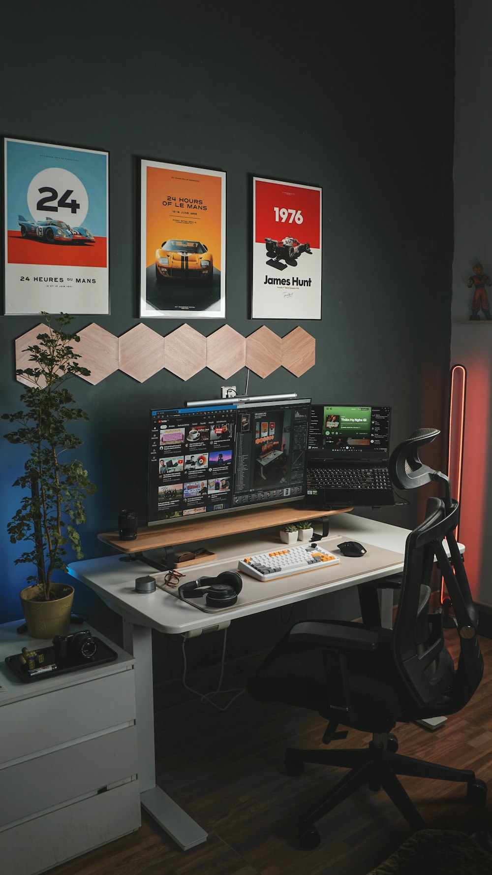 a desk with a computer and a chair in front of it