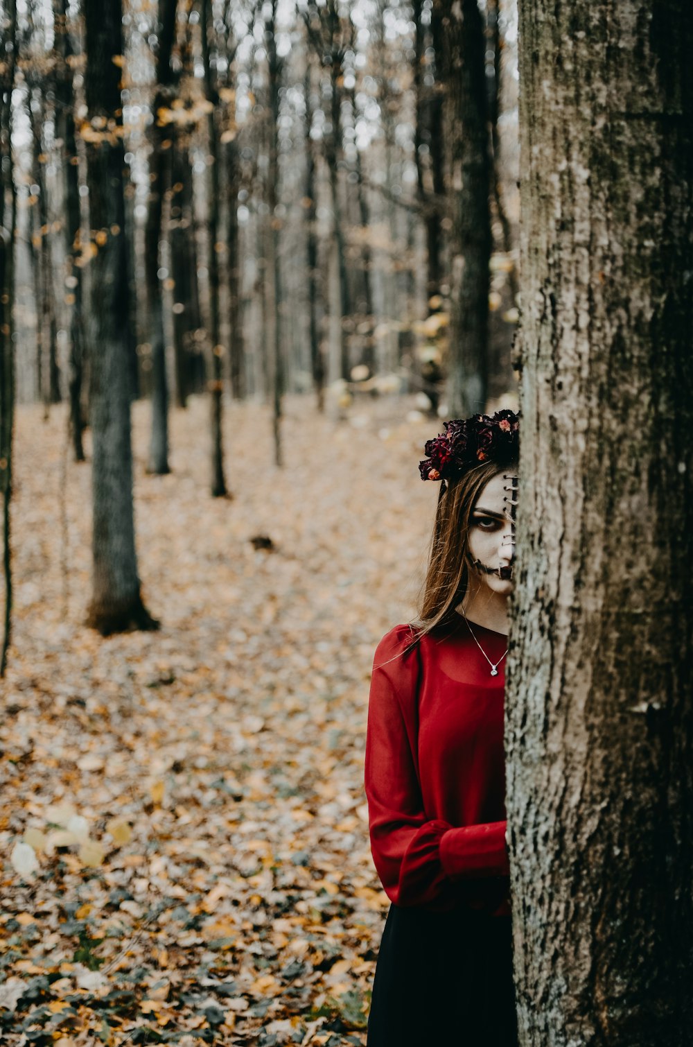 a person standing next to a tree