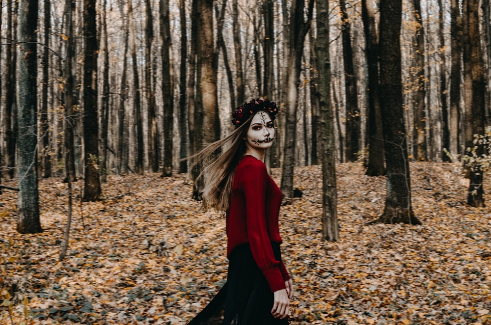 a person in a red dress in a forest