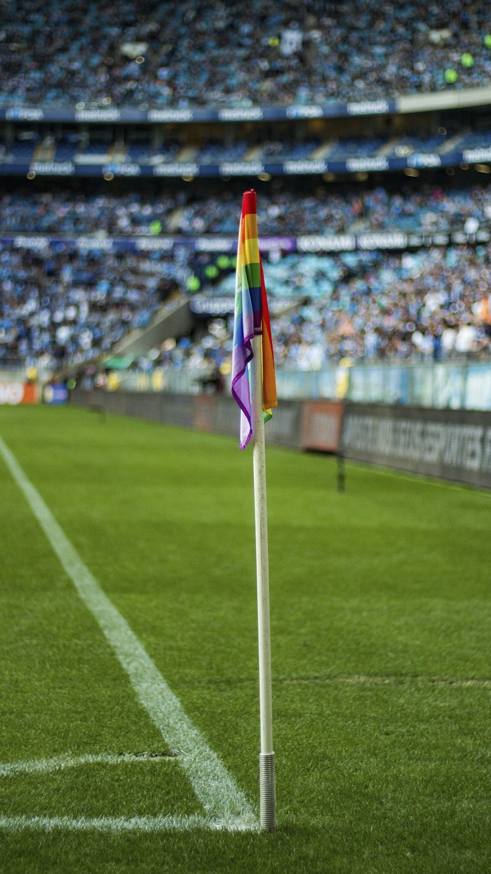 a flag on a pole in a stadium