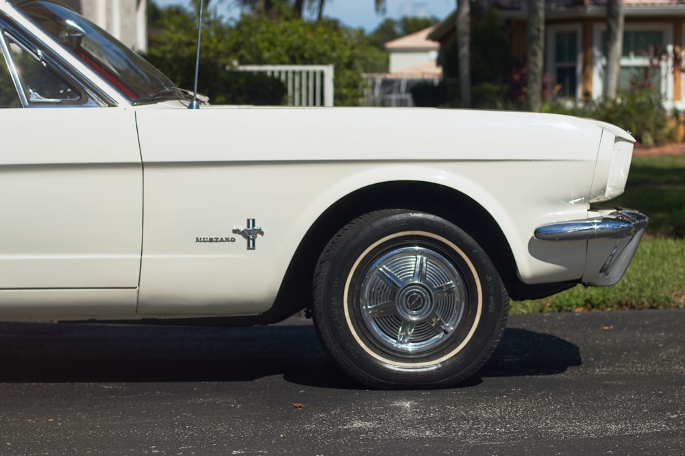 a white car parked on the side of the road