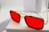 A pair of stylish sunglasses with bold red lenses rests on a white surface. The frame is a combination of gold and black, giving the eyewear a luxurious and modern appearance.