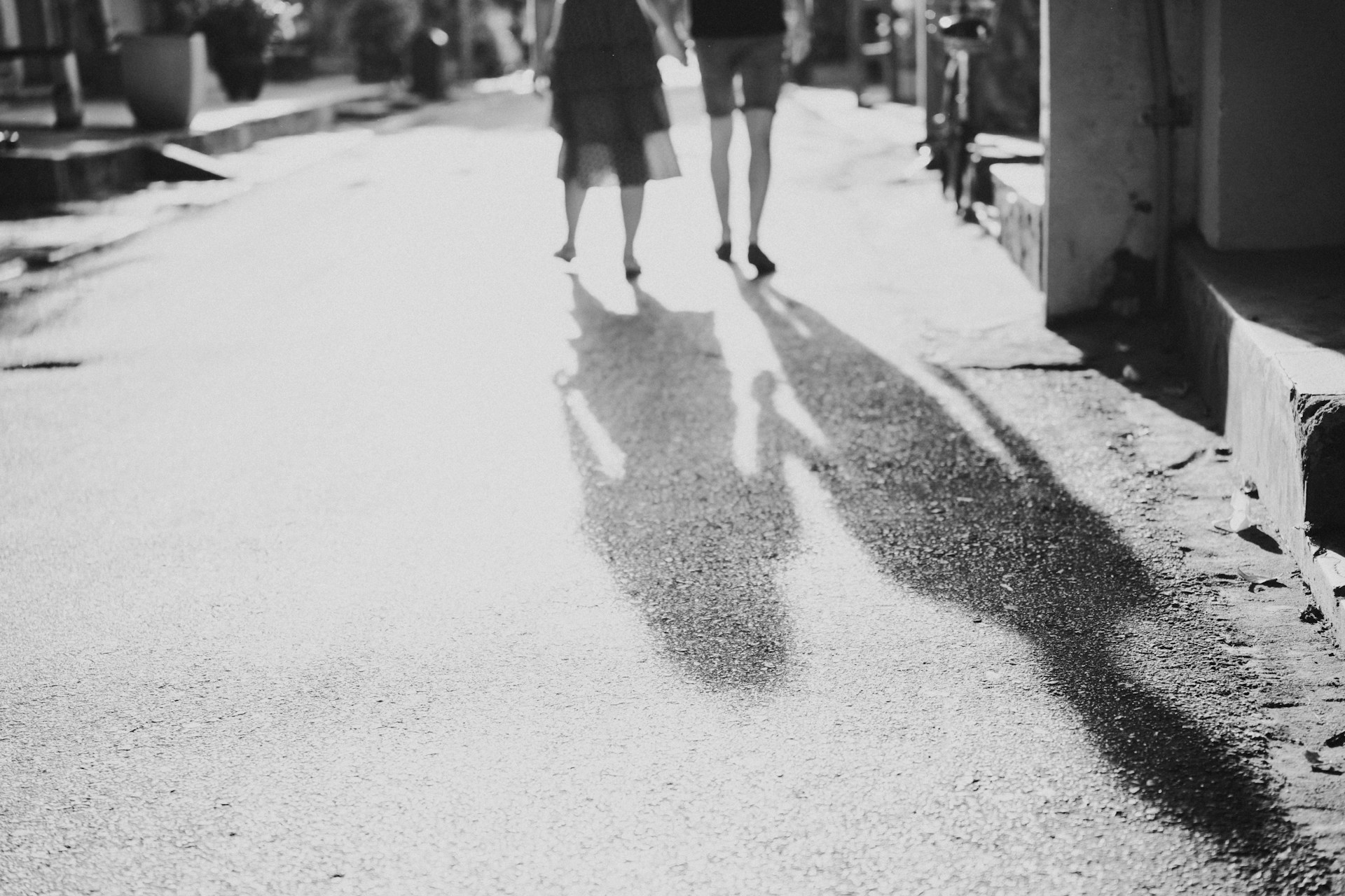 a couple people walking on a street