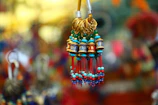 Close-up of local handicrafts and jewelry displayed in a Himachal market.