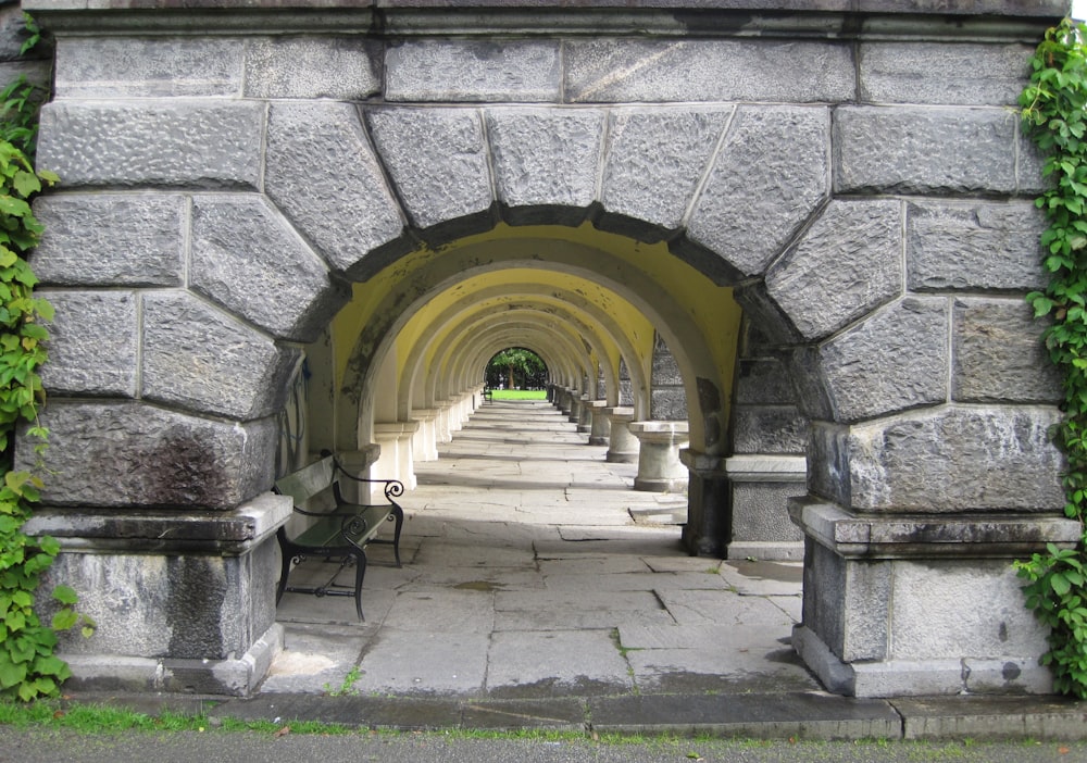 a stone building with a bench