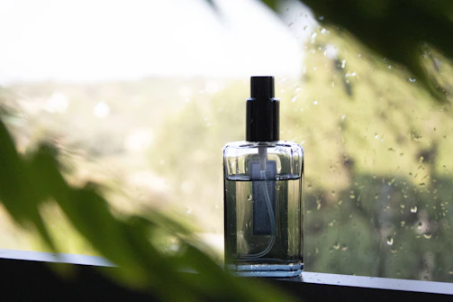 Cozy home interior with a spray bottle on a wooden table near a window.