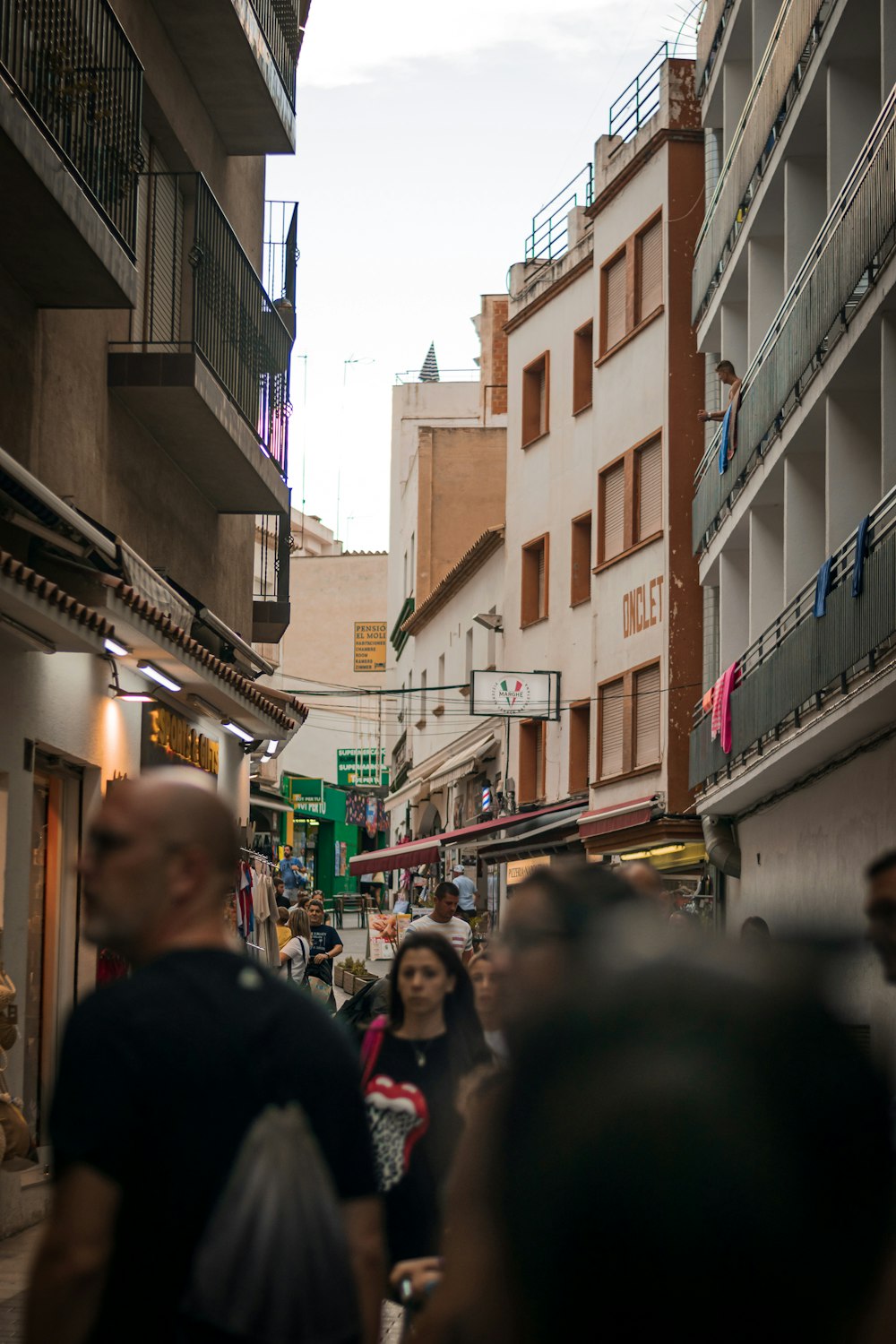 a group of people walking through a city