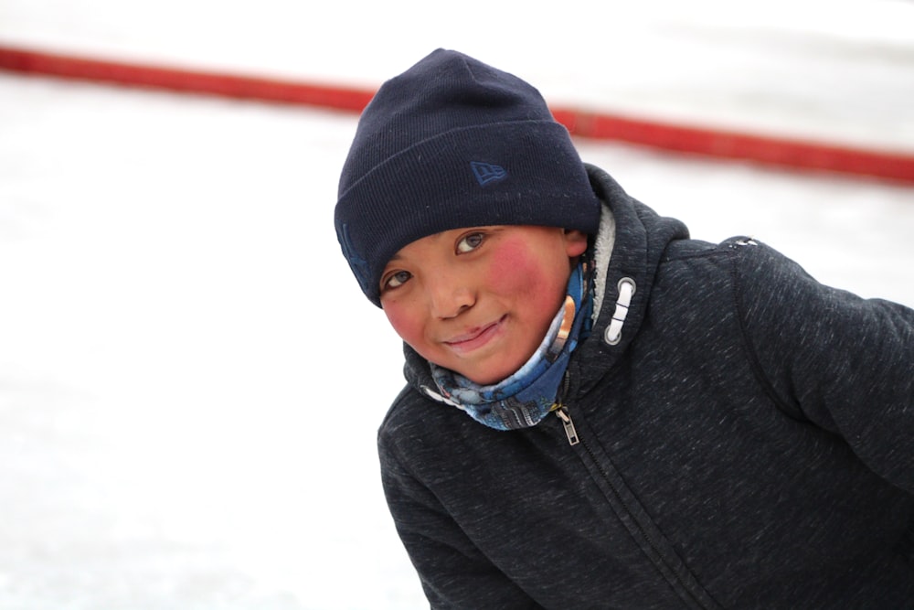 a person wearing a hat and scarf