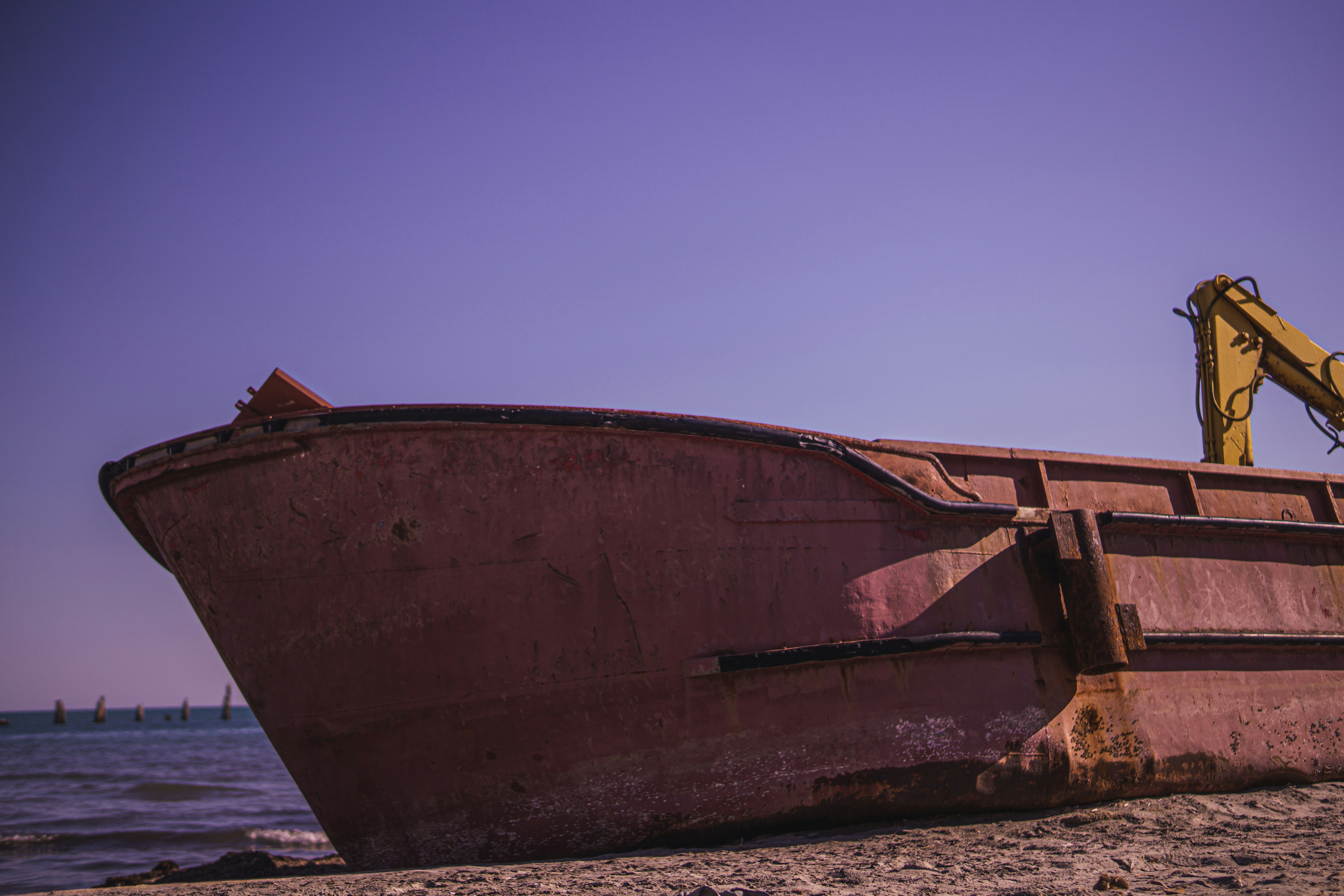 a rusty boat on the beach