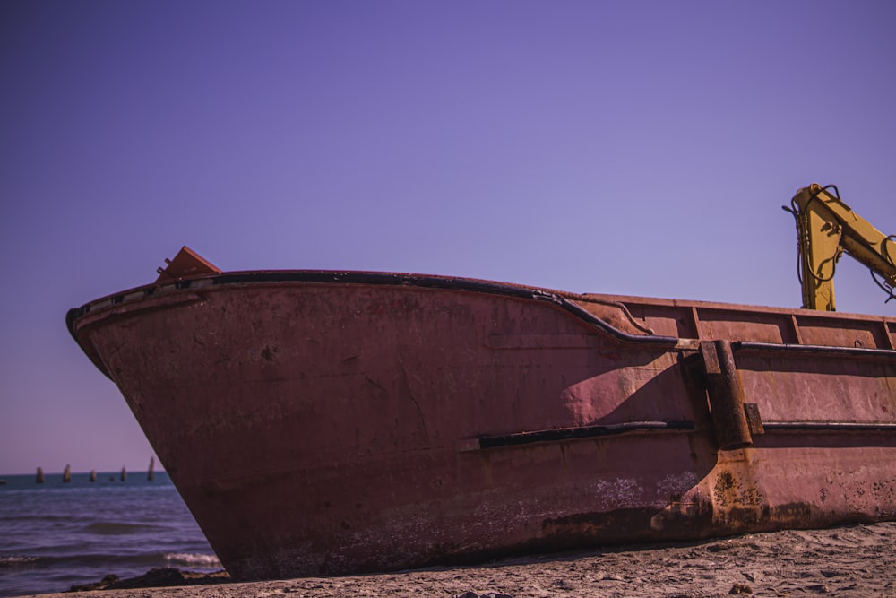 a rusty boat on the beach