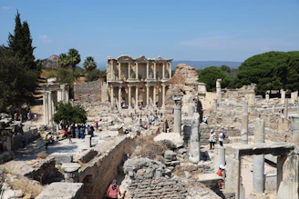 A group of people exploring ancient ruins in Huelva during a guided tour.