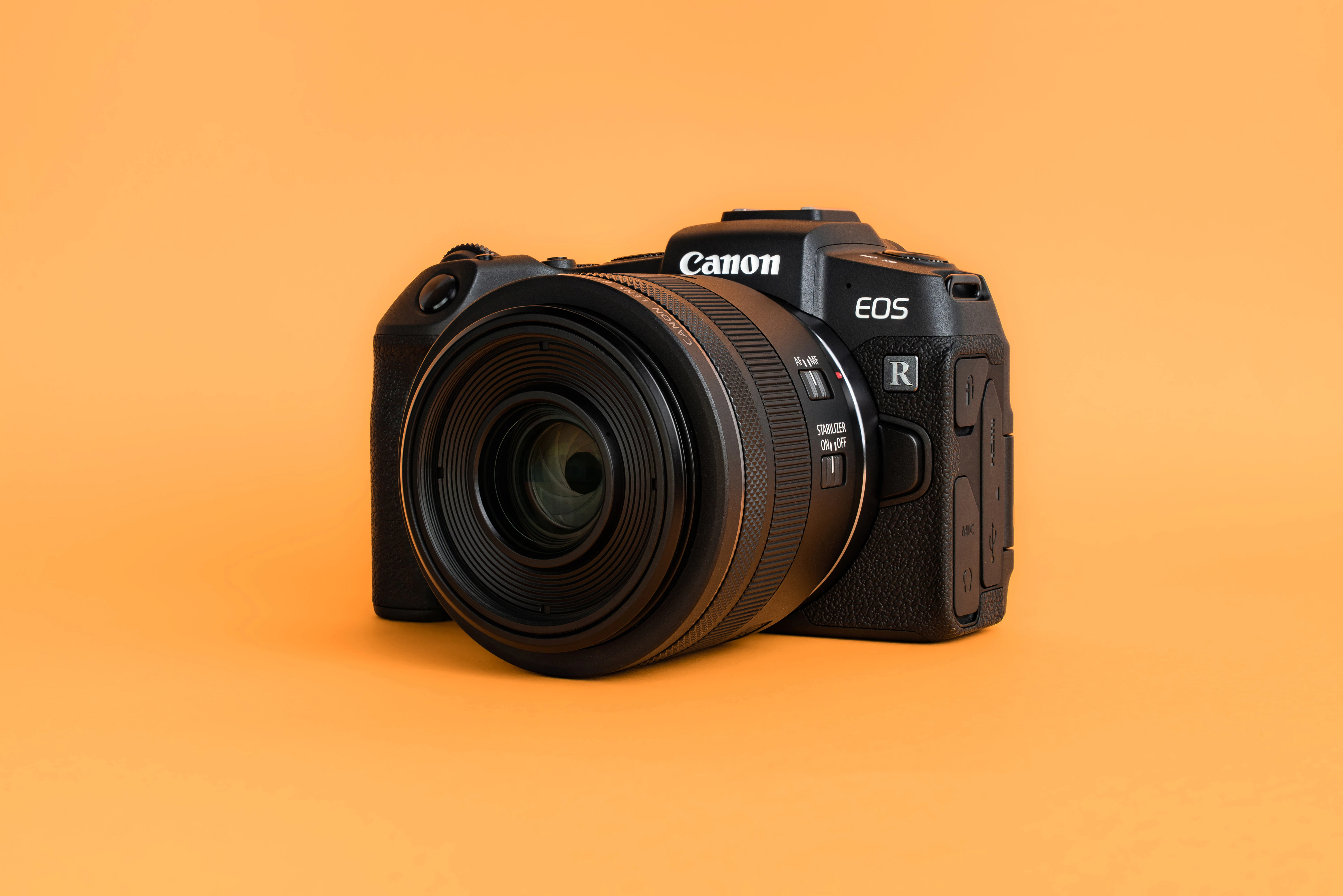 Canon EOS mirrorless camera body with an RF lens attached, representing the compact full-frame form factor of the EOS R8