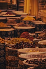 a group of bowls full of spices