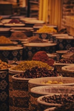 a group of bowls full of spices