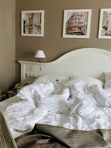 A cozy bedroom featuring a decorative drawing board.