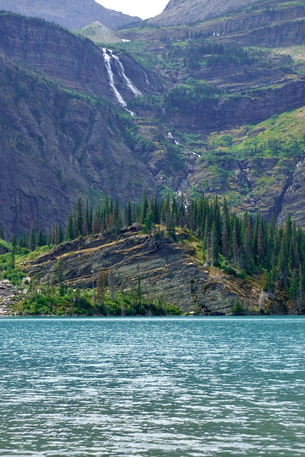 a waterfall and a forest