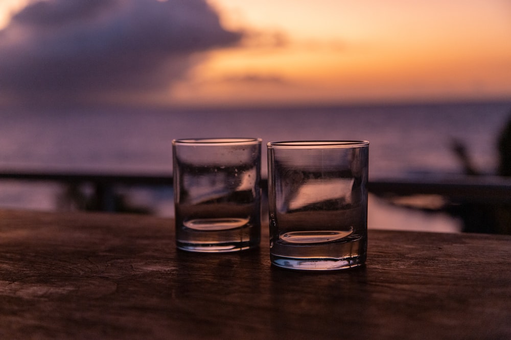two glasses of water on a table