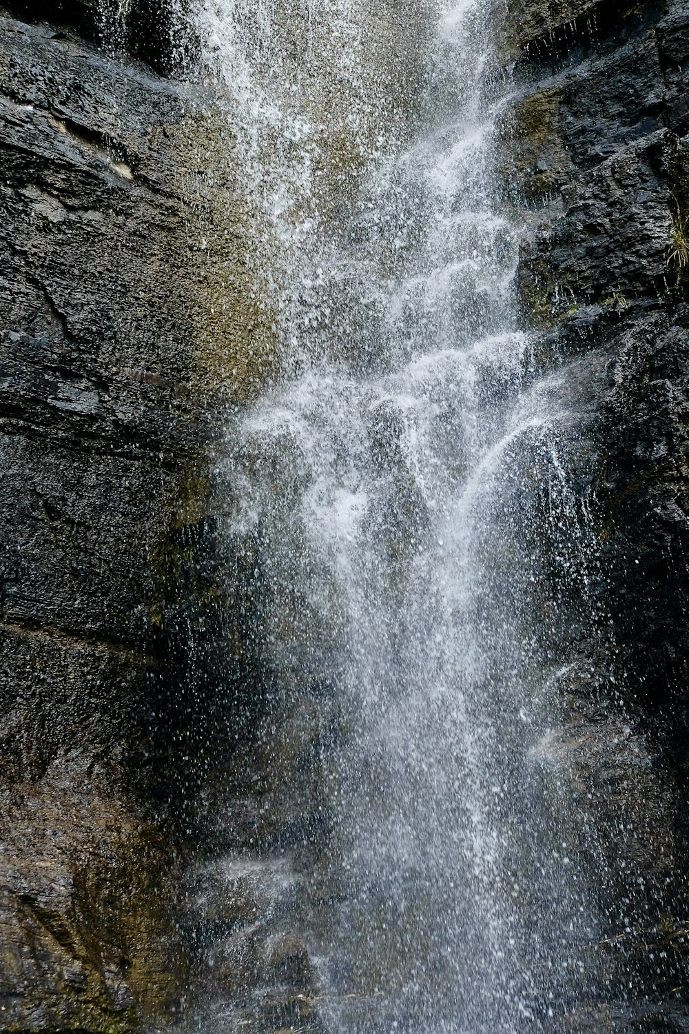 a waterfall with rocks