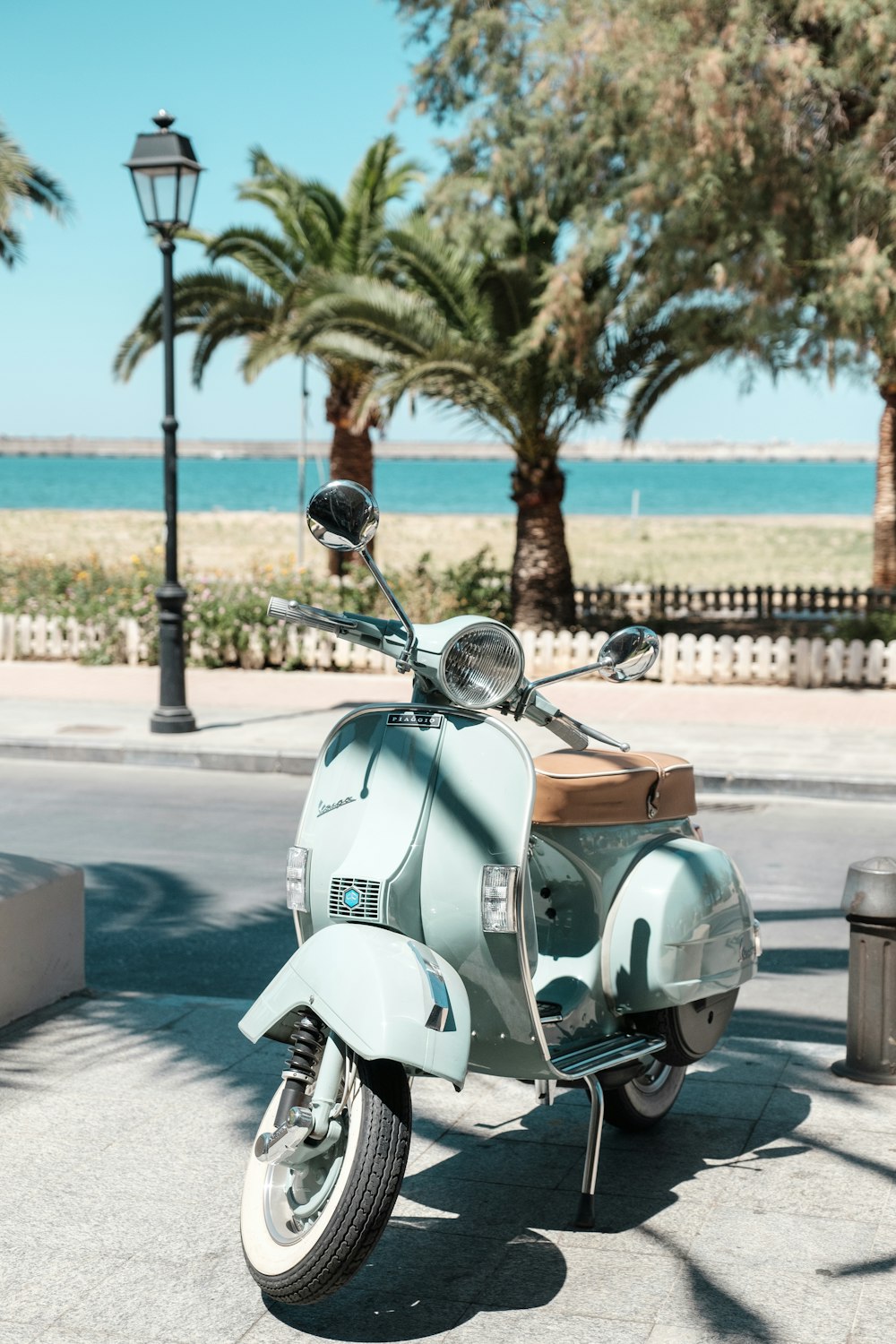 a scooter parked on the side of a road