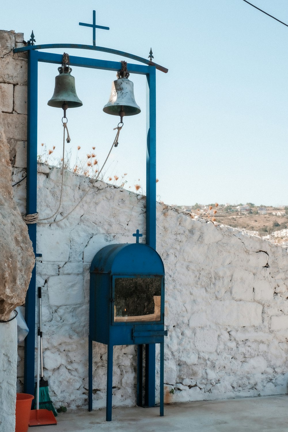 a bell on a blue door
