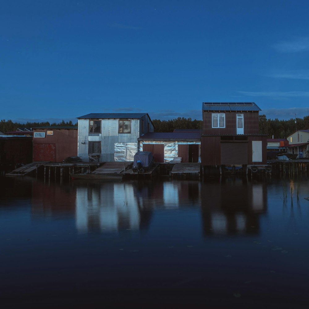 a group of buildings next to a body of water