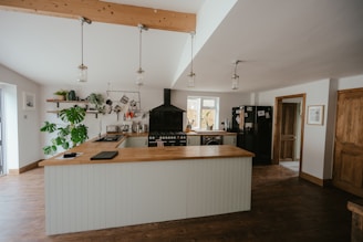 a kitchen with a bar and island