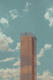 a tall building with a blue sky