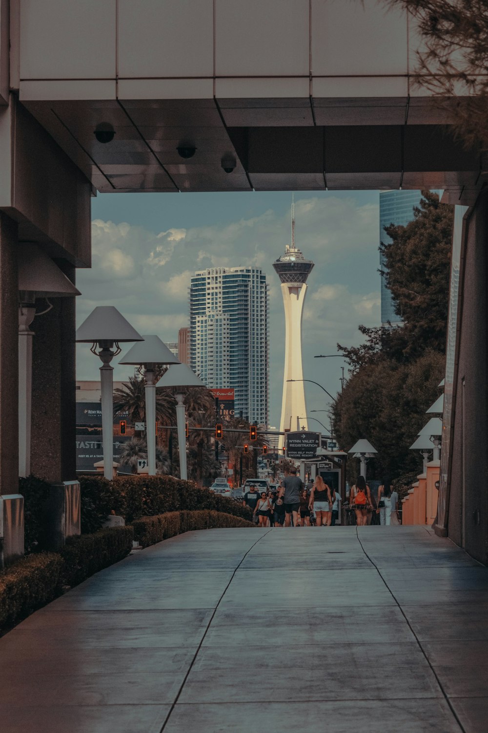 a walkway with a tall tower in the background