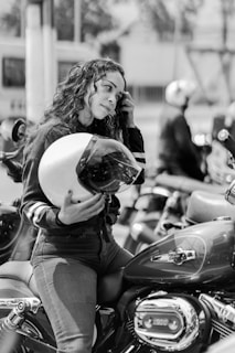 a person on a motorcycle talking on the phone