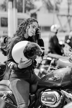 a person on a motorcycle talking on the phone