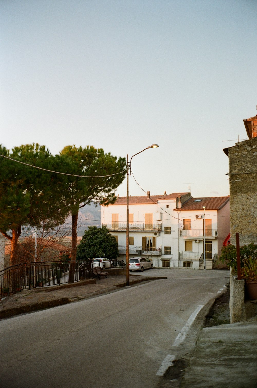 a street with cars and buildings on the side