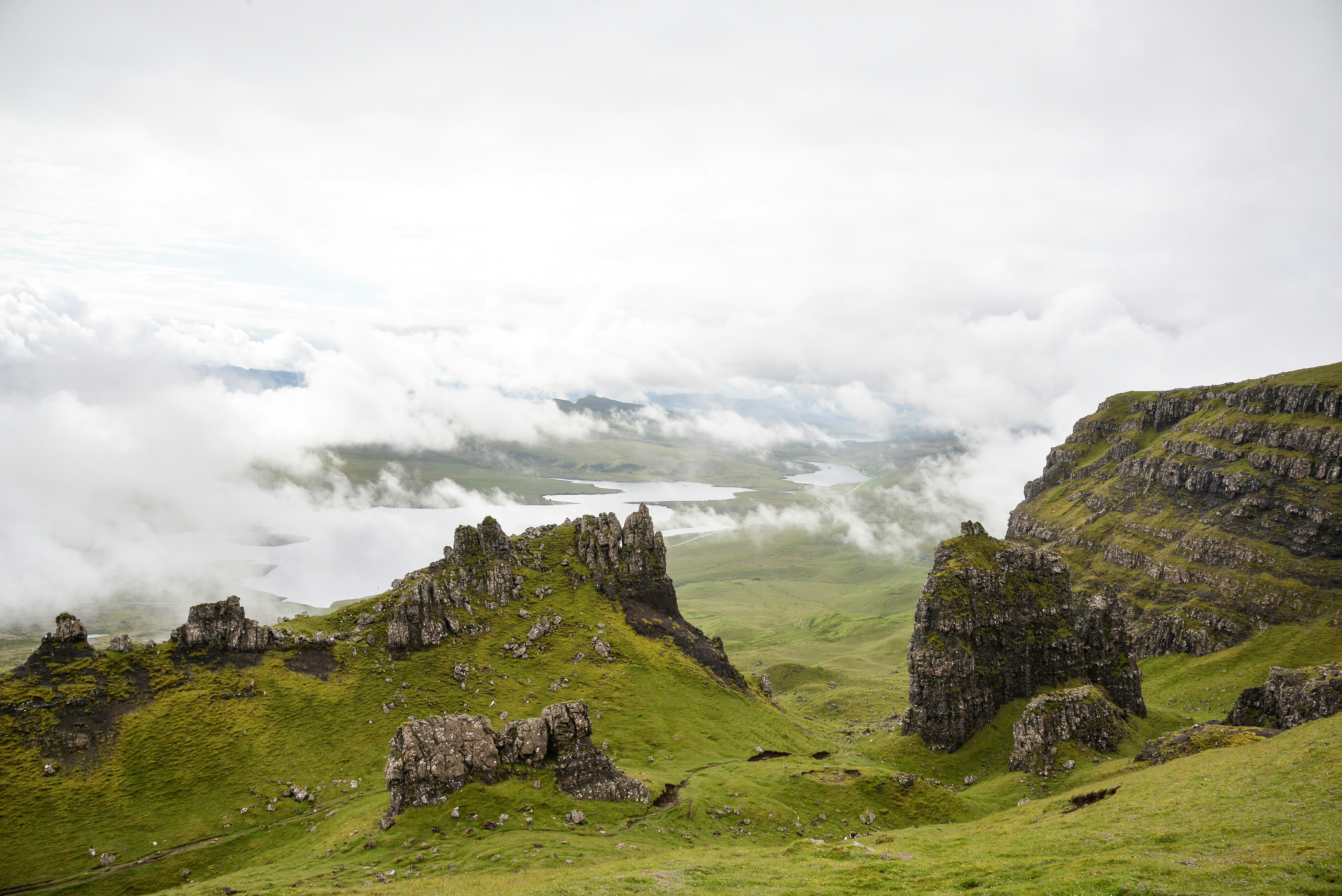 A grassy hill with rocks on it