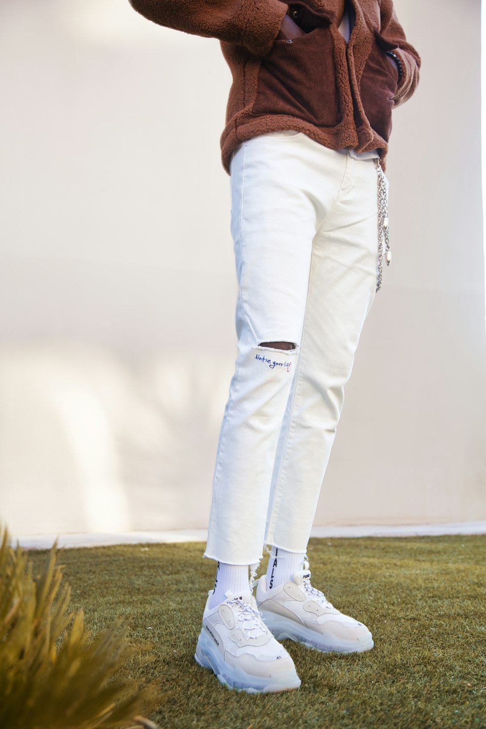 a person wearing white pants