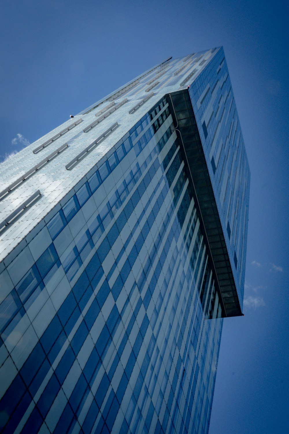 a tall building with a glass front