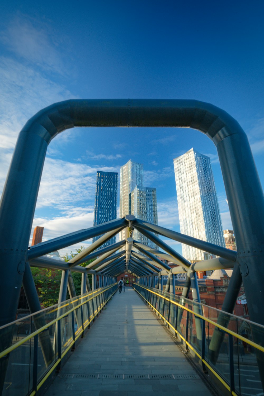 a bridge with a city in the background