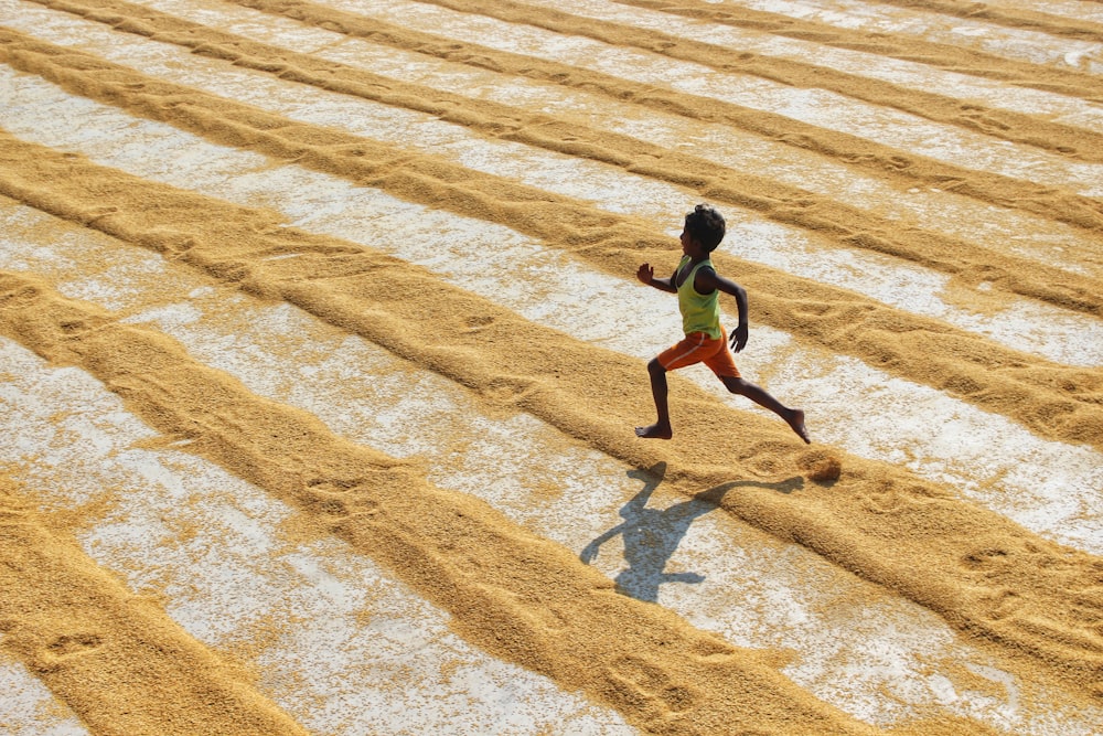 a person walking in the sand