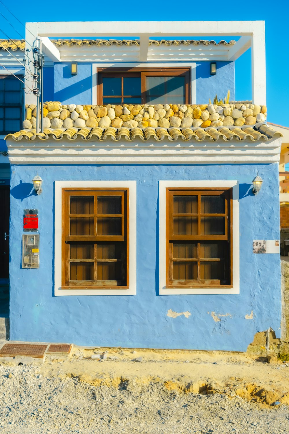 a blue building with windows