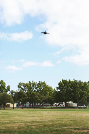 Drone flying over a large commercial building with clear skies in Newfoundland.