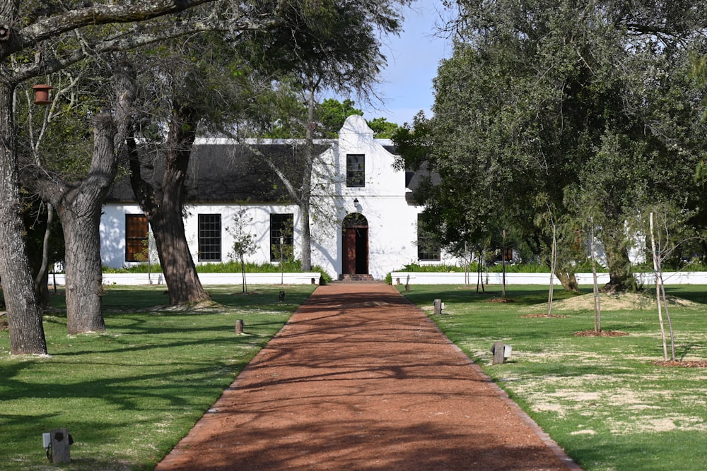 a white house with a brick path